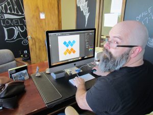 Brand Development Services Web Designer Working on Brand Development Services