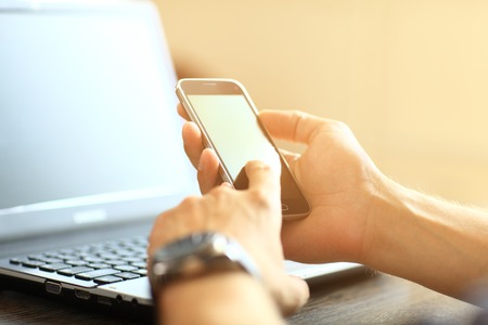 Generate HVAC Leads Man on Phone and PC Looking to Generate HVAC Leads